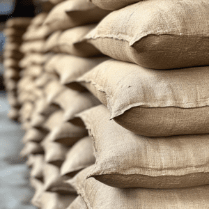 A stack of filled sandbags arranged neatly, showcasing the uniformity and quality of the filling.