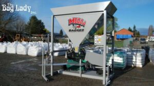 An automated sandbagging machine designed to fill sandbags efficiently, set up in an outdoor space.